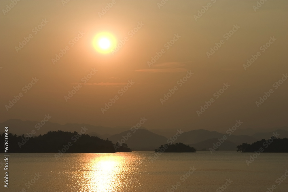 Sun set with golden light at dam