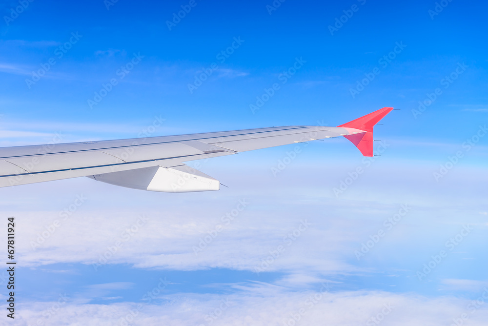 Fototapeta premium Looking through window aircraft during flight in wing with a nic