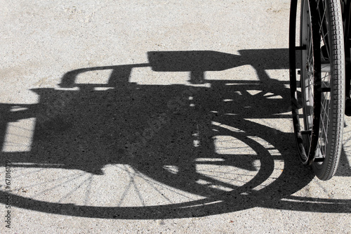 shadow of the wheelchair and the tyre