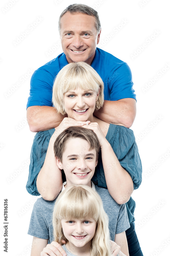 Cheerful family of four standing in a row Cheerful family of four standing in a row