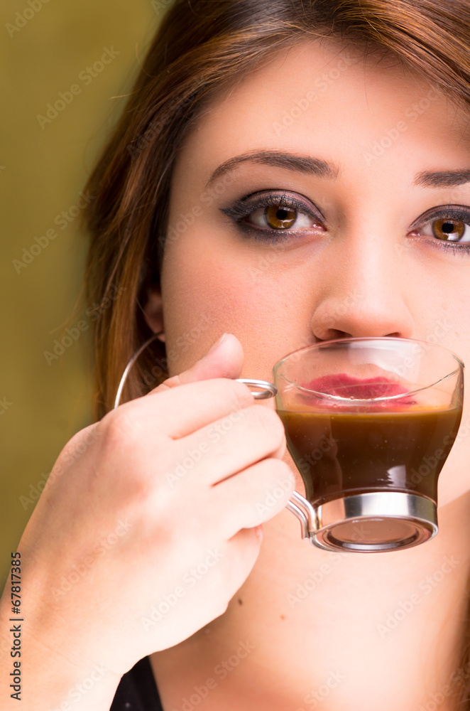 closeup of a beautiful girl drinking coffee closeup of a beautiful girl drinking coffee