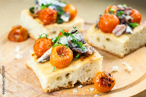 Delicious focaccia with sardines and cherry tomatoes