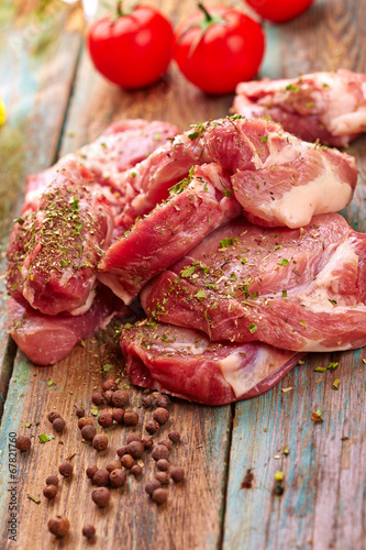 Meat over wooden background