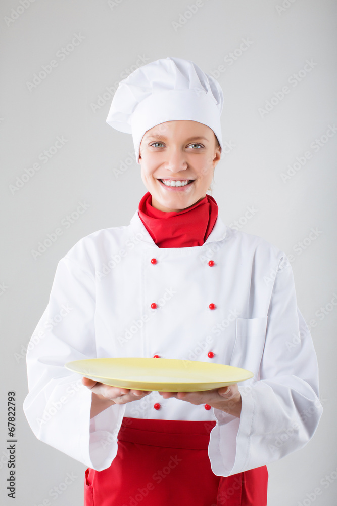 cooking and food concept - smiling female chef, cook or baker wi cooking and food concept - smiling female chef, cook or baker wi