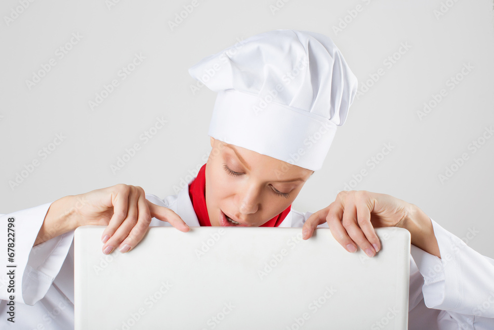 Chef or baker woman showing blank empty billboard sign. Chef or baker woman showing blank empty billboard sign.