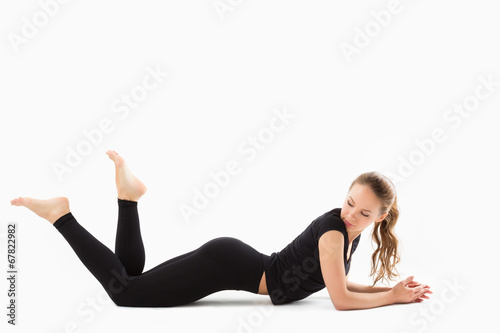Young beautiful fitness girl exercising in gym