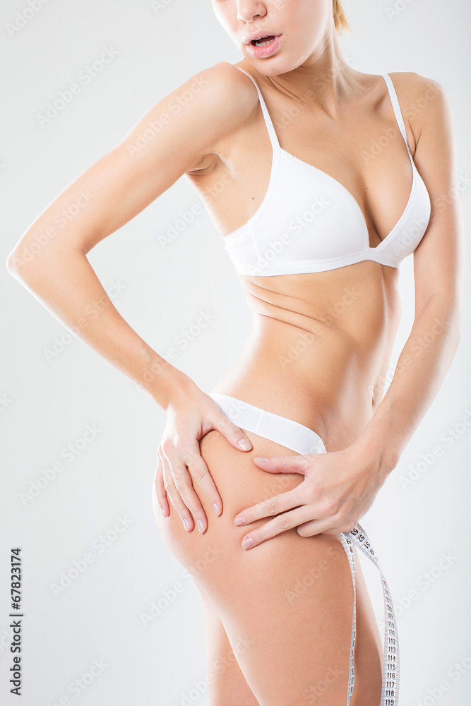 Woman's fingers touching her body parts in the shape of a heart Woman's fingers touching her body parts in the shape of a heart