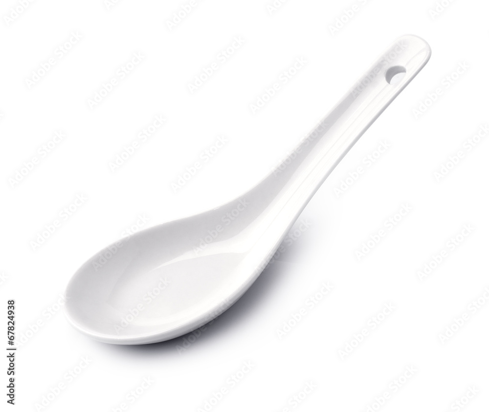 White empty ceramic spoon for soup on white background White empty ceramic spoon for soup on white background