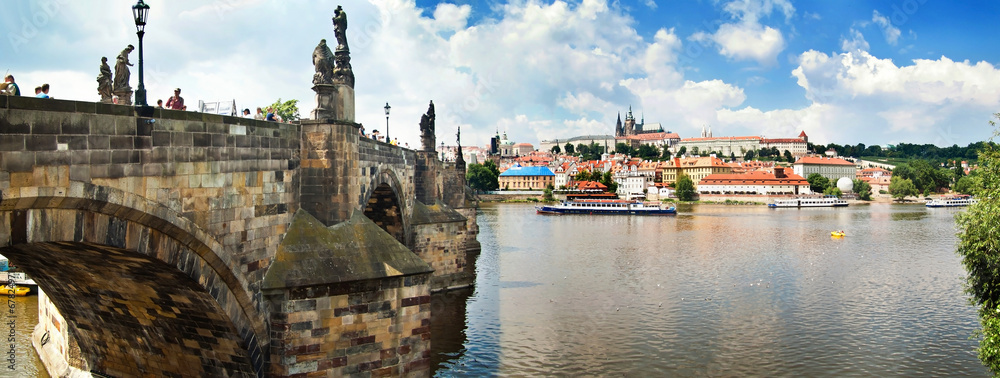 Fototapeta premium Panoramic view of Karlov Bridge historical buildings in Prague,