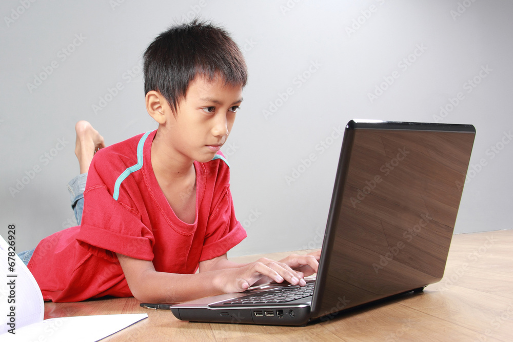 kid using laptop kid using laptop