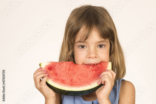  little girl eating watermelon