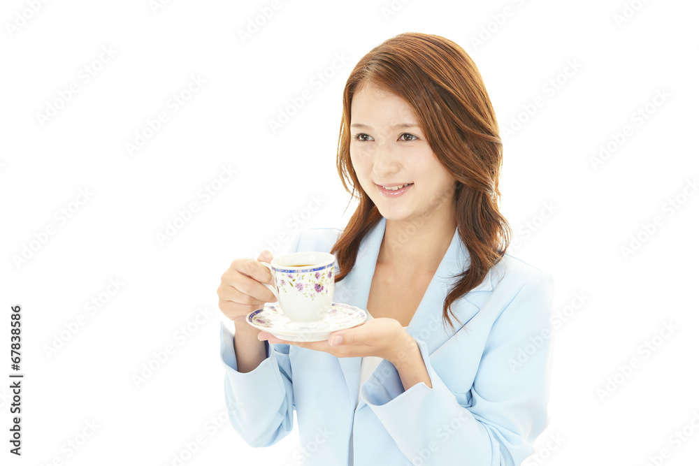コーヒーを飲む笑顔のＯＬ