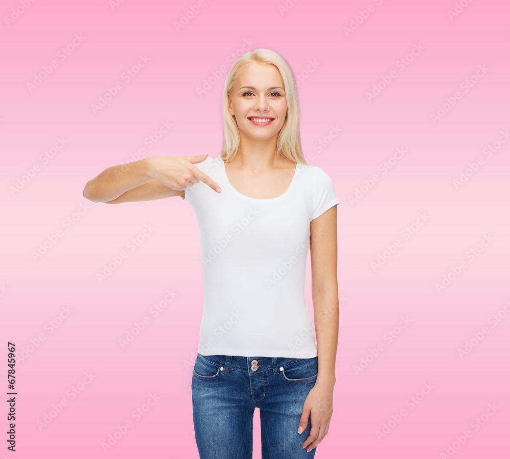 Fototapeta premium smiling young woman in blank white t-shirt
