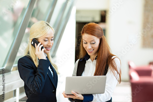 Excited surprised business women receiving good news via email