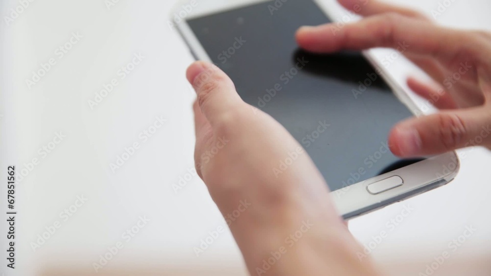 hand using writing on smart phone on white background hand using writing on smart phone on white background
