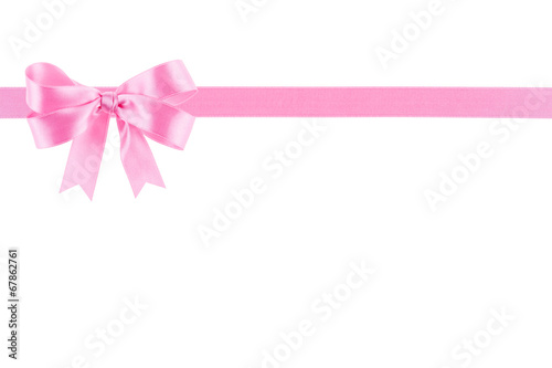 Pink ribbon with a bow on white background © diyanadimitrova