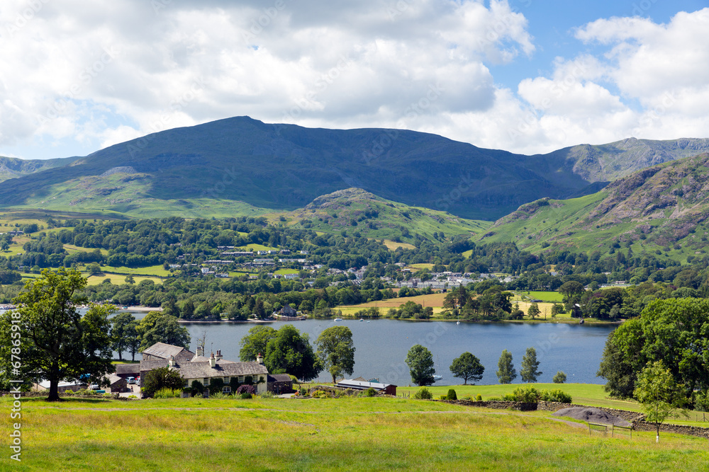 Coniston Water and mountains Lake District England uk blue sky