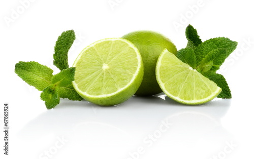 Wallpaper Mural Three sliced limes with mint isolated on a white background
