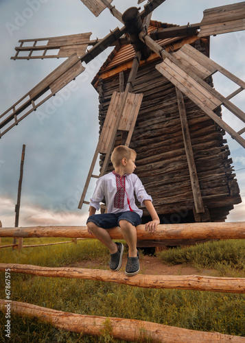 ukrainian boy near old mill