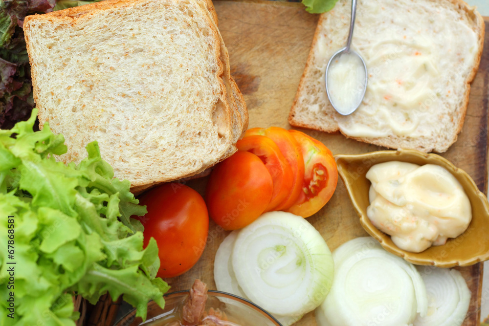 making tuna sandwich with fresh vegetables making tuna sandwich with fresh vegetables