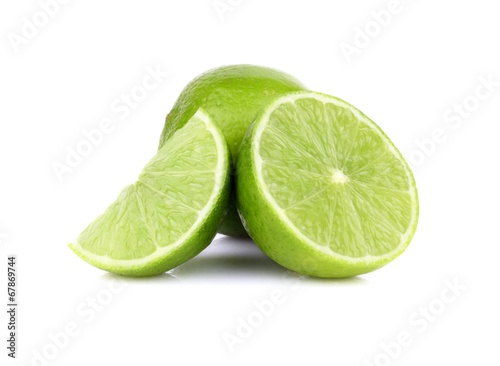 Three sliced limes isolated on a white background