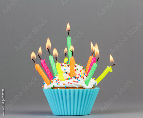 Cupcake with colorful candles
