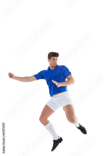 Football player in blue jersey jumping