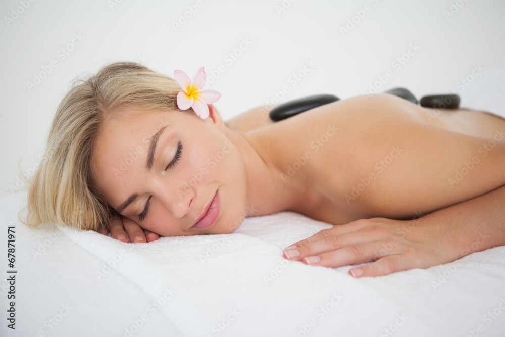 Beautiful blonde enjoying a hot stone massage Beautiful blonde enjoying a hot stone massage