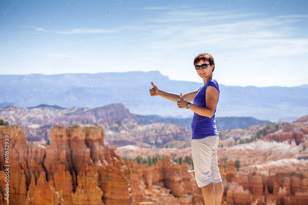 Smiling tourist showing ok sign