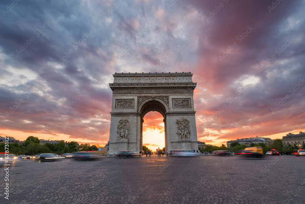 Arc de Triomphe and traffic along the Champs-Elysees at sunset w