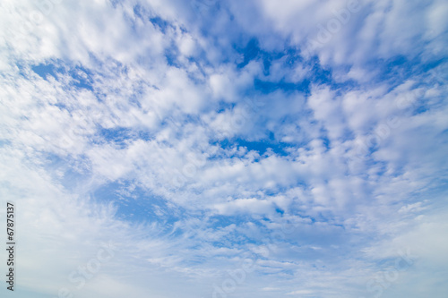 blue sky background with tiny wave clouds