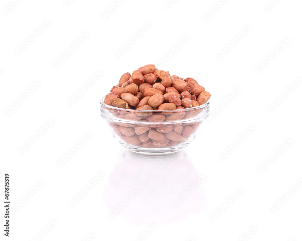 Full glass bowl with peanuts. Full glass bowl with peanuts.