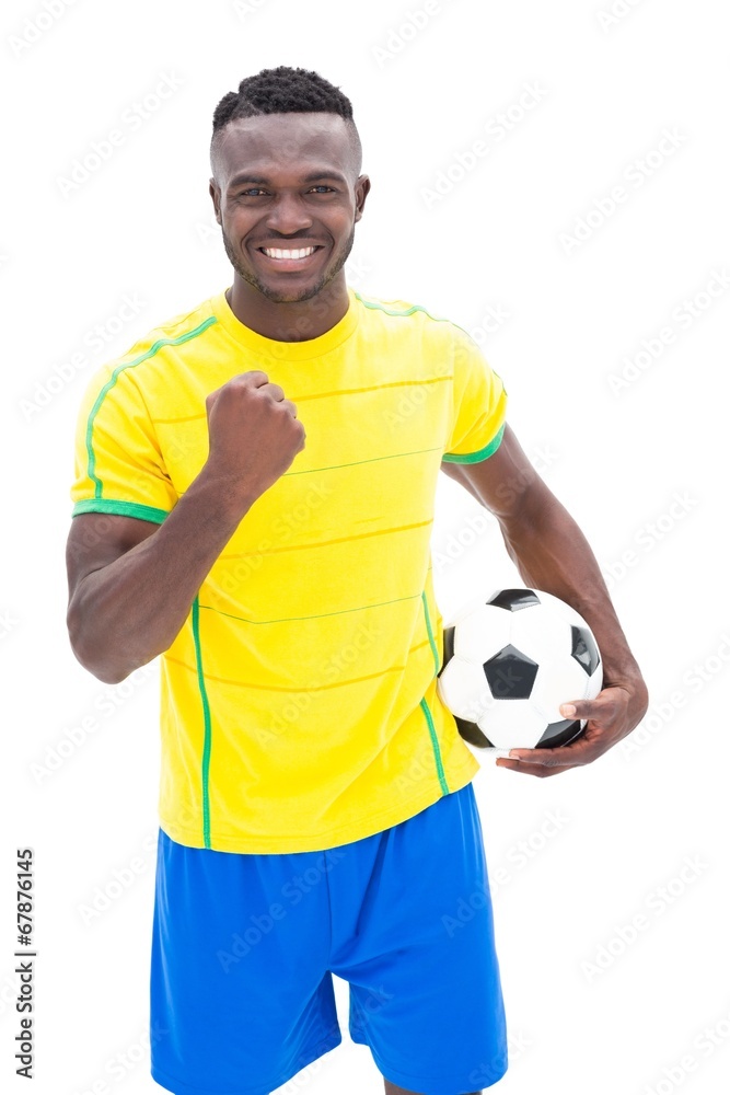 Football player in yellow celebrating a win Football player in yellow celebrating a win
