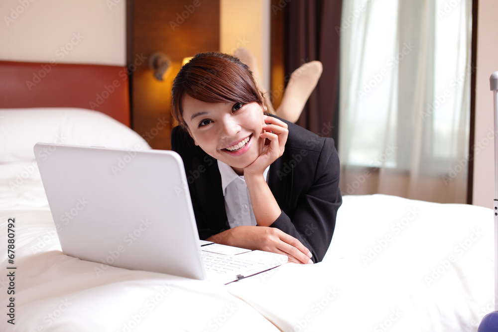 business woman with notebook lying in hotel business woman with notebook lying in hotel