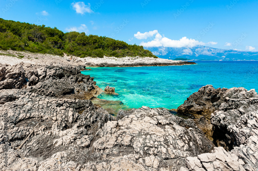 Rocky shore with turquoise sea water. Adriatic coast of Korcula Rocky shore with turquoise sea water. Adriatic coast of Korcula