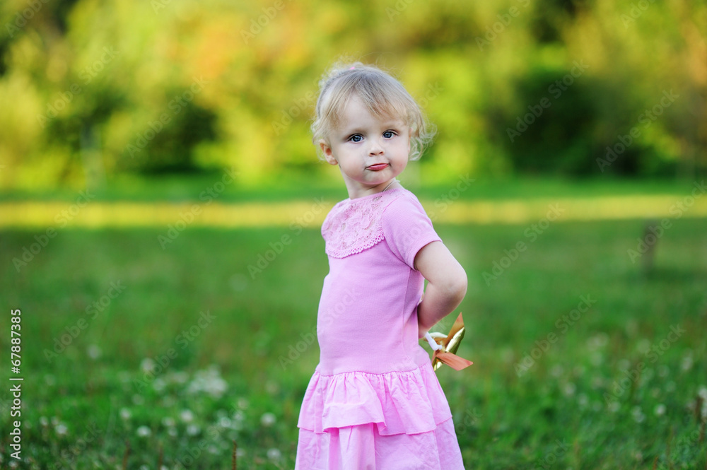 Portrait of adorable child girl walking outdoors Portrait of adorable child girl walking outdoors