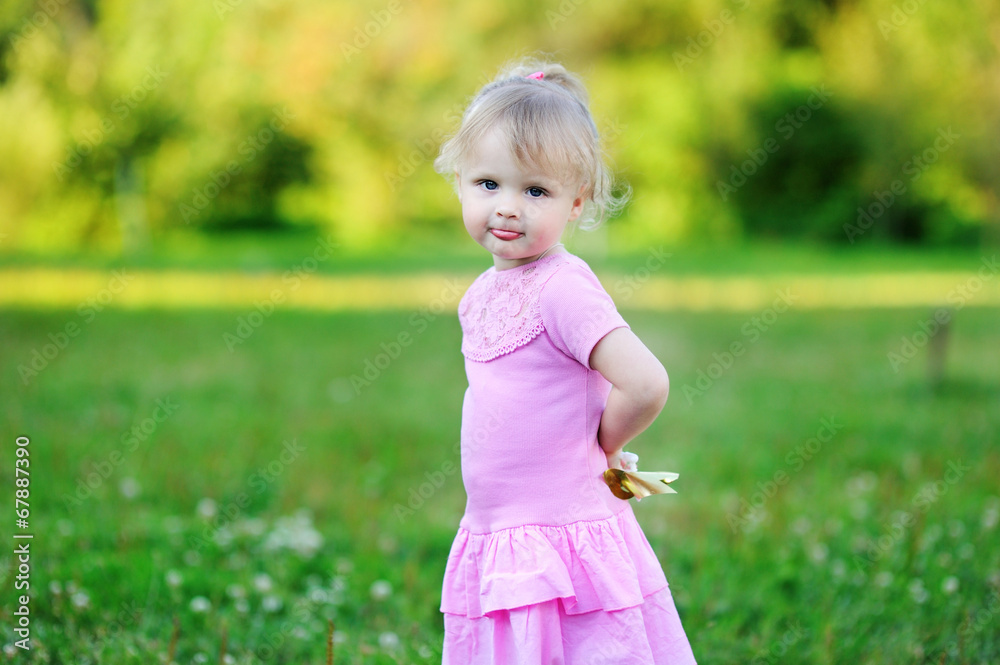 Portrait of adorable child girl walking outdoors Portrait of adorable child girl walking outdoors