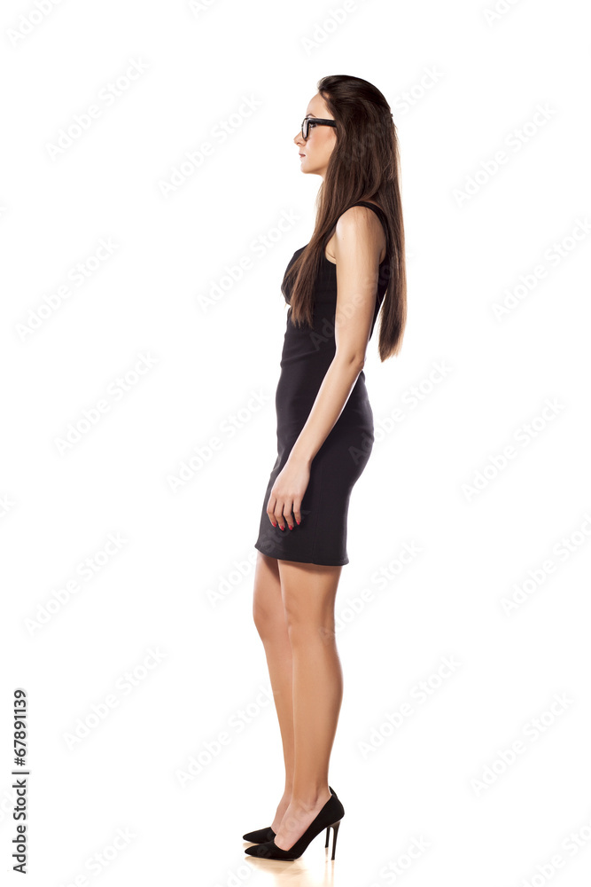side view of a business woman in a short black dress side view of a business woman in a short black dress