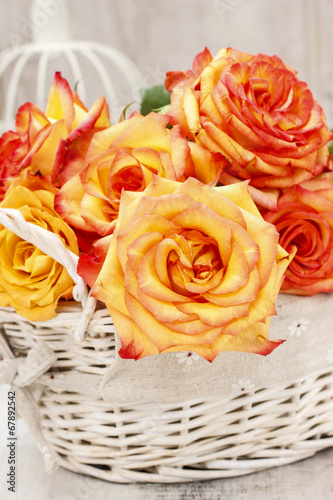 Bouquet of roses in wicker basket