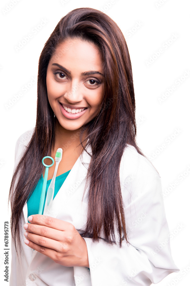 Dentist doctor holding brush and mirror Dentist doctor holding brush and mirror