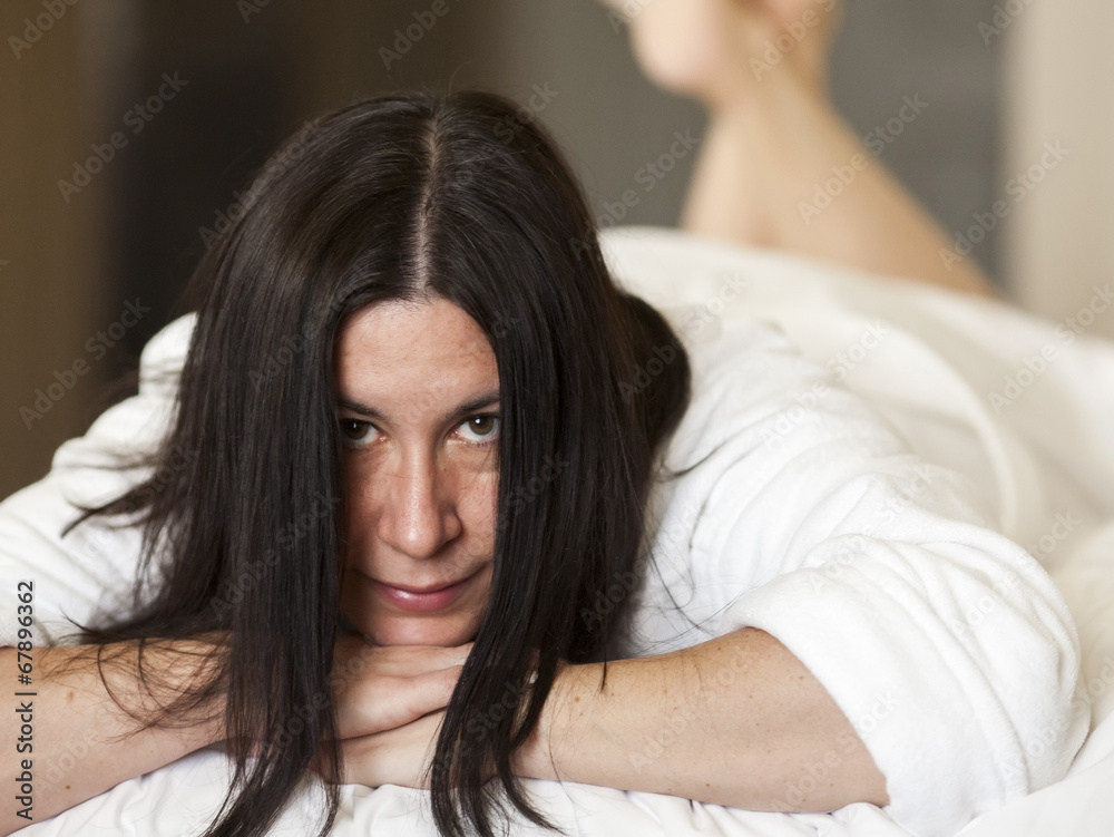 Fototapeta premium Young brunette relaxing in a white bathrobe 3