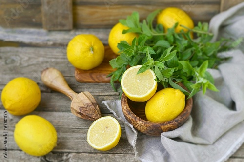 juicy and ripe organic lemons in a on a wooden background