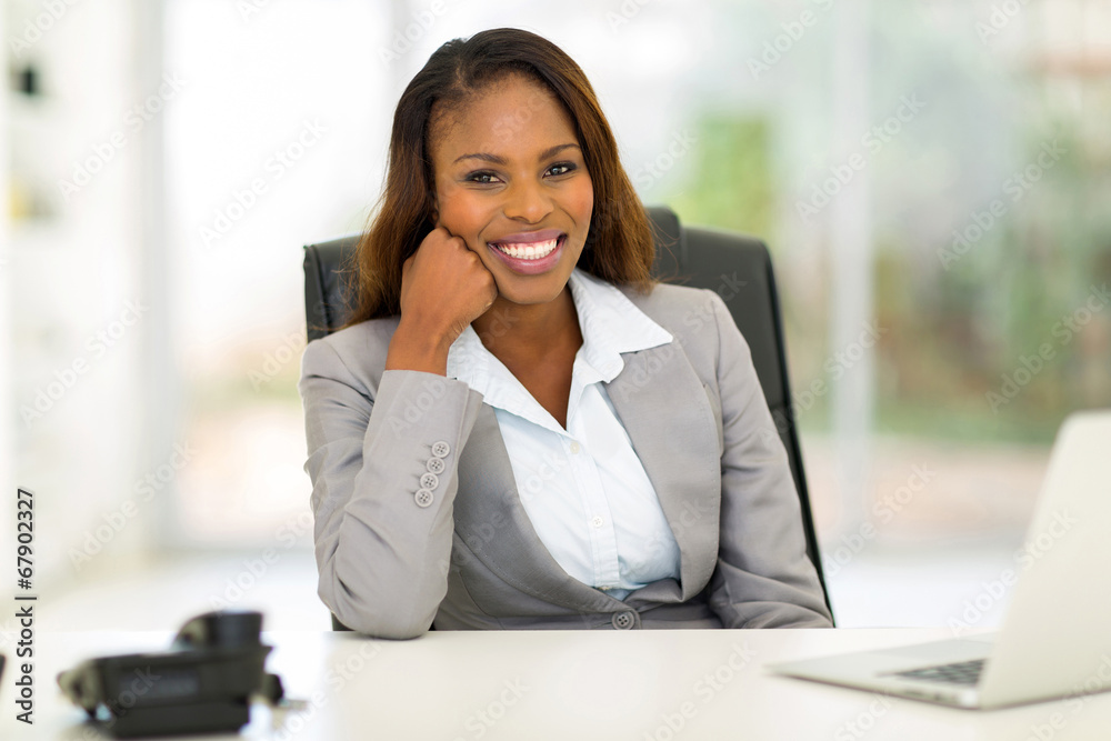 young african businesswoman sitting in office young african businesswoman sitting in office