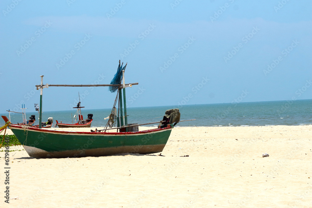 Fishing boat the sand sea beach.