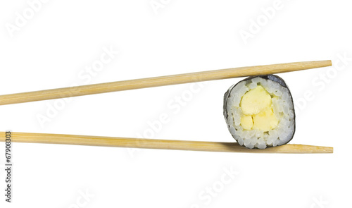 Avocado sushi roll in chopsticks isolated on white background