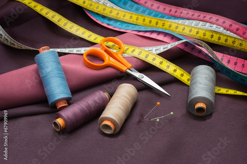 Thread Spools, Pin, Measuring Tapes and Scissors.