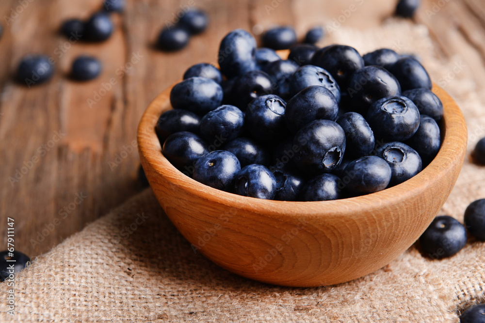 Delicious blueberries in bowl on table close-up Delicious blueberries in bowl on table close-up