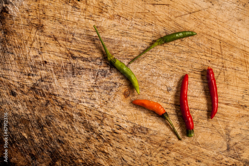 chili on wood background.