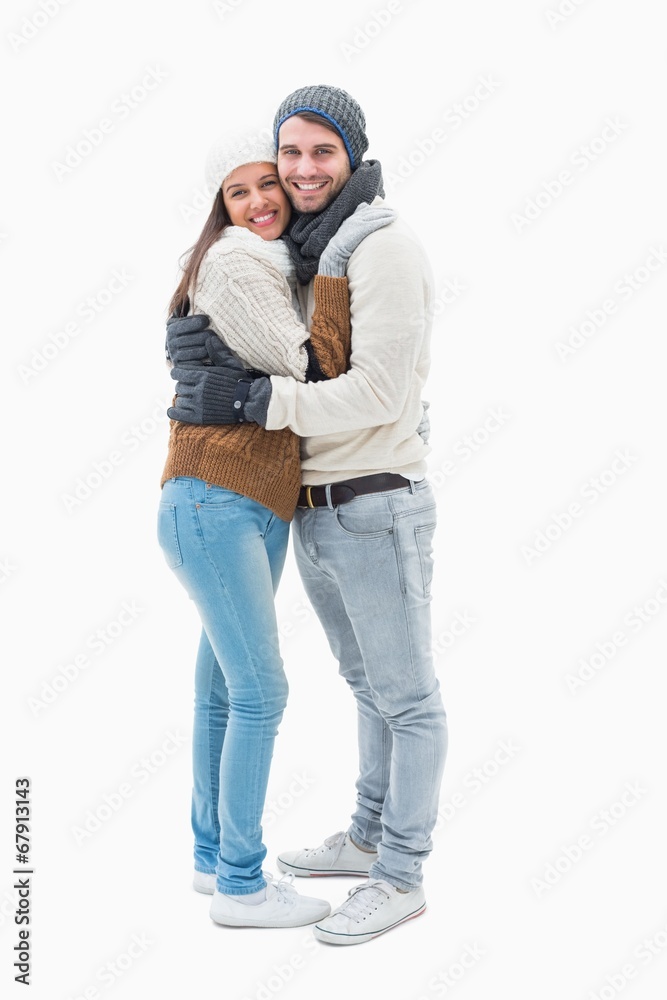 Attractive young couple in warm clothes hugging Attractive young couple in warm clothes hugging