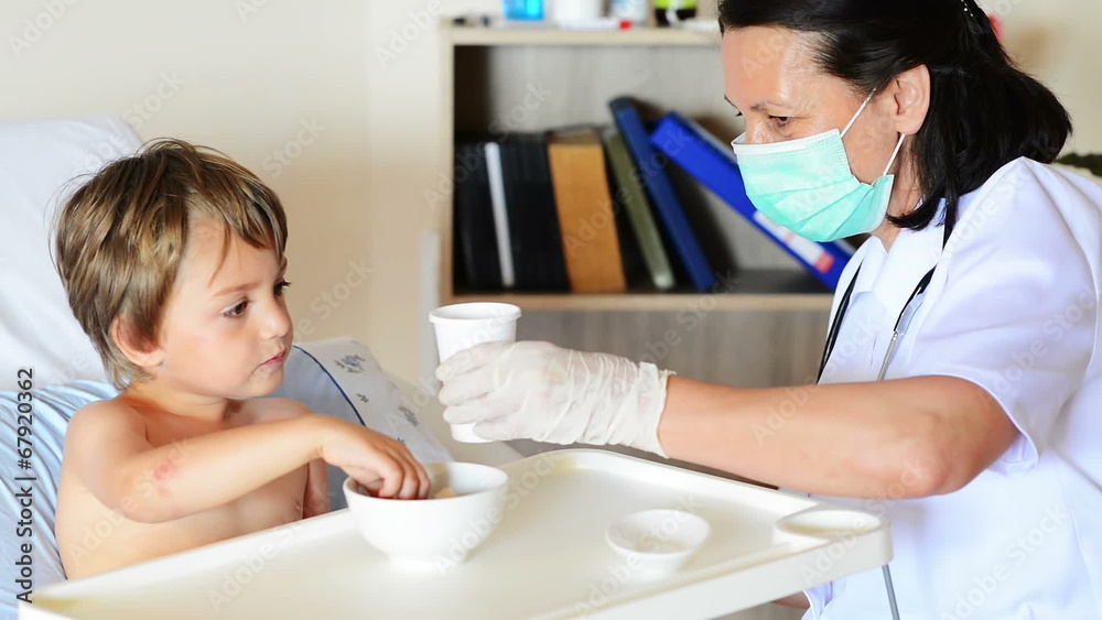Kid eating and drinking under doctor observation Kid eating and drinking under doctor observation